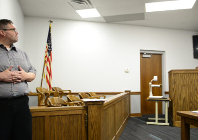 Probation officer Jeremy Greene looks on as Judge John Kolesar holds drug court in Clyde. About 30 people have gone through drug court since its inception, with five of them graduating.