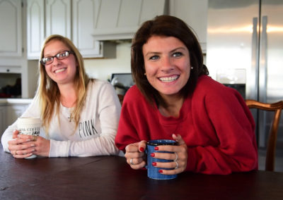 Recovering heroin addict Alexandria Lowery, 26, left, and recovering meth addict Ashley Ammerman, 23, support each other in sobriety at Light House Sober Living in Port Clinton. “I came here because I wanted that second chance,” Ammerman said.