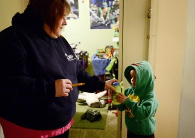 Tae’s mother, Brandy Lagasse, gives him medicine at 6 a.m. the morning of a biweekly chemotherapy treatment session. The drive from Port Clinton to Cleveland will take two-and-a-half hours, due to heavy traffic.