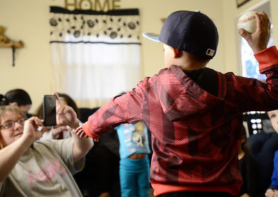 Brandy Lagasse, Tae's mother, takes pictures of him with his presents at his fifth birthday party. Tae also has mismatch repair deficiency syndrome which makes him especially vulnerable to other cancers developing in his body.